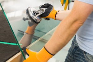 A team member of Glass Specialty WLC creates a custom Window Replacement in Galesburg IL