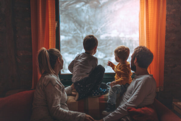 Replacement Windows Macomb IL, Portrait of a young family with two little boys, and third one on the way, being surprised by snow, early in the morning - right after waking up